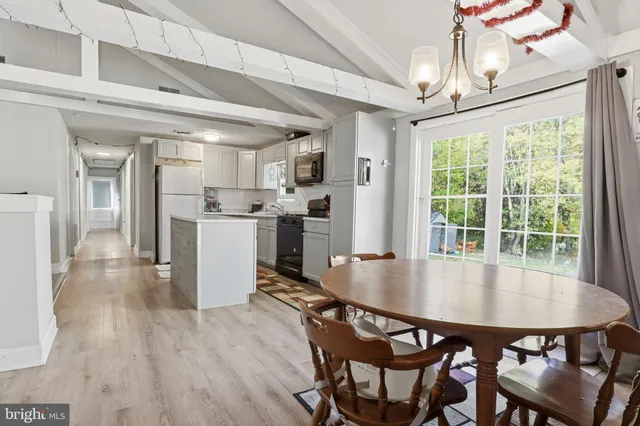 a kitchen with stainless steel appliances granite countertop a sink stove and microwave
