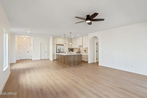 a view of a kitchen with a sink and wooden floor