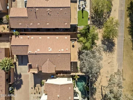 a front view of a house with outdoor seating