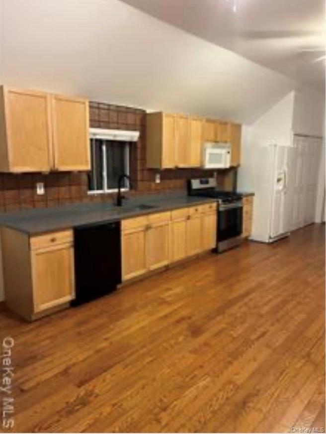 13 Spring Street, Unit 2A Warwick, NY 10990 - Photo 18 of 20 a large kitchen with granite countertop a sink and cabinets