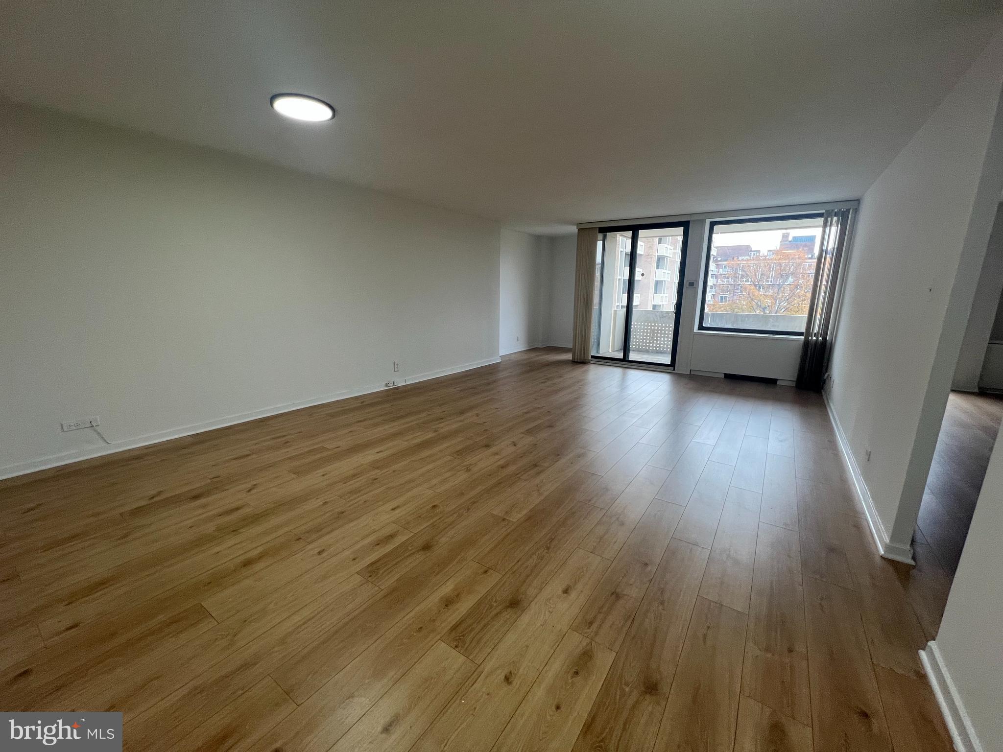 490 M Street Southwest, Unit 505 Washington, DC 20024 - Photo 2 of 12 a view of wooden floor and windows in a room