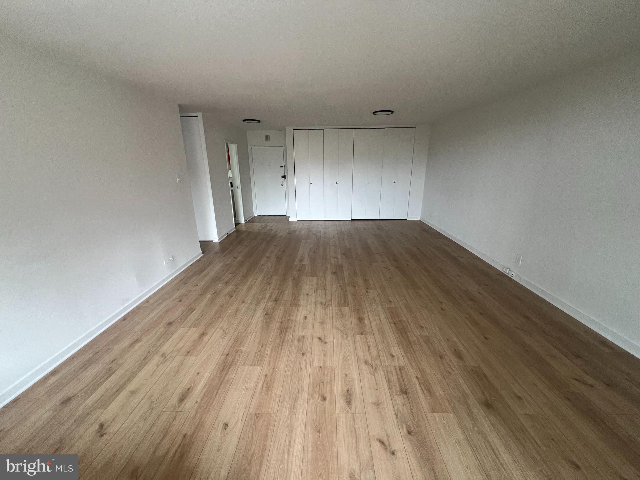 490 M Street Southwest, Unit 505 Washington, DC 20024 - Photo 3 of 12 a view of empty room with wooden floor