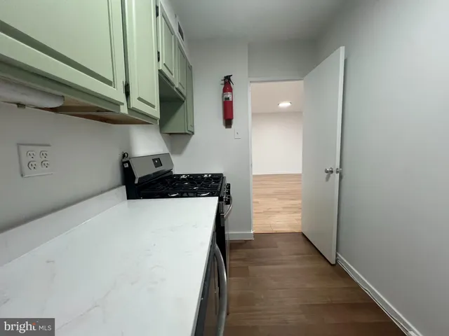 a kitchen with stainless steel appliances a refrigerator and a stove