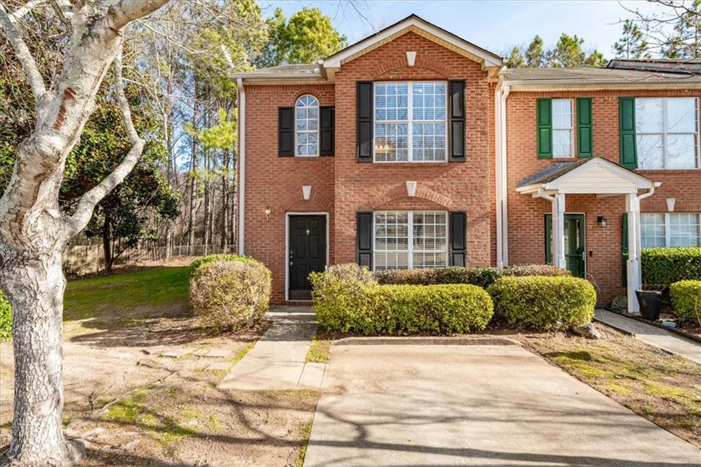 2814 Norfair Loop Lithonia, GA 30038 - Photo 1 of 18 a front view of a house with garden