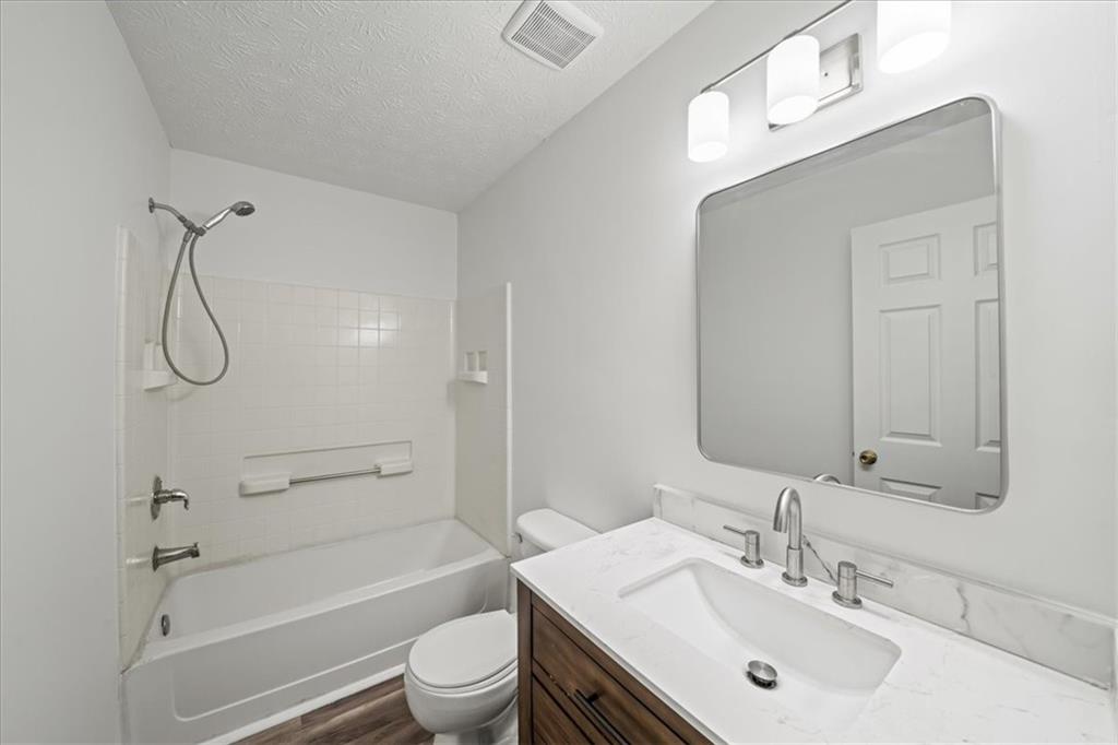 2814 Norfair Loop Lithonia, GA 30038 - Photo 13 of 18 a bathroom with a sink toilet and shower