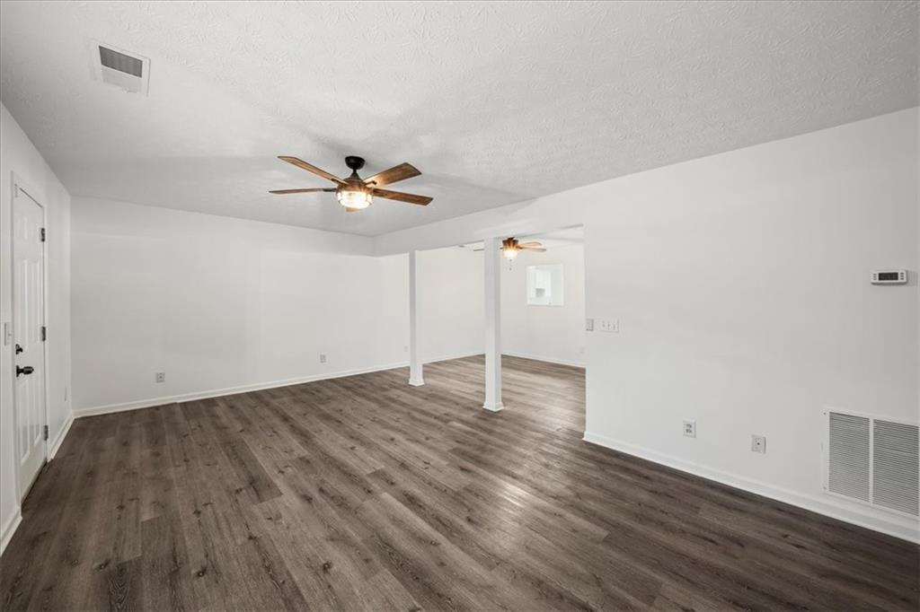 2814 Norfair Loop Lithonia, GA 30038 - Photo 3 of 18 wooden floor in an empty room with a window