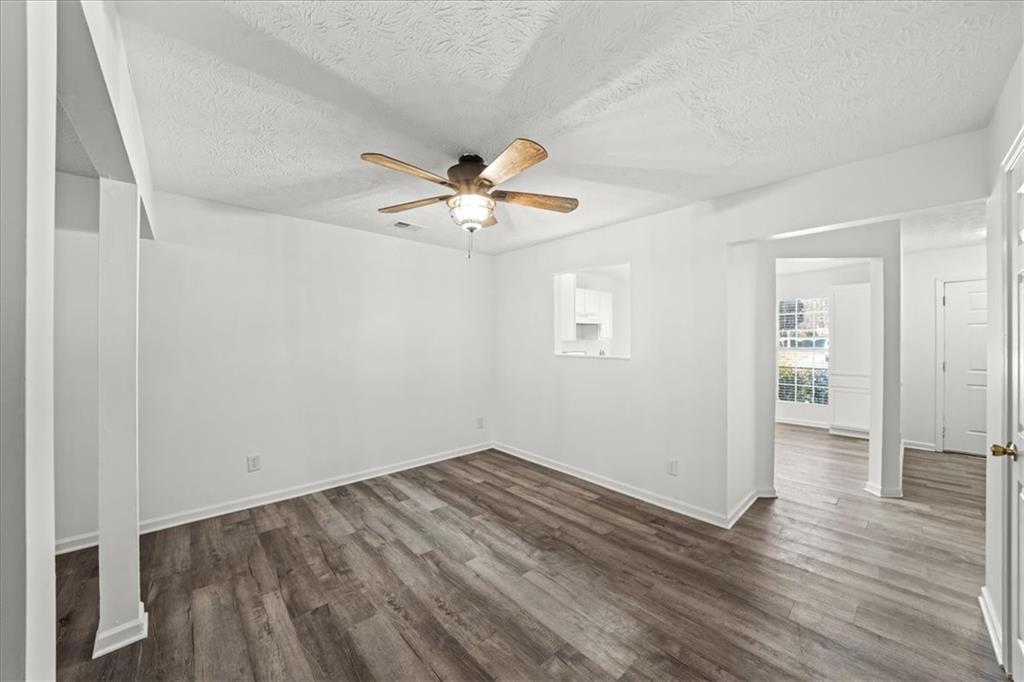 2814 Norfair Loop Lithonia, GA 30038 - Photo 4 of 18 wooden floor in an empty room with a window