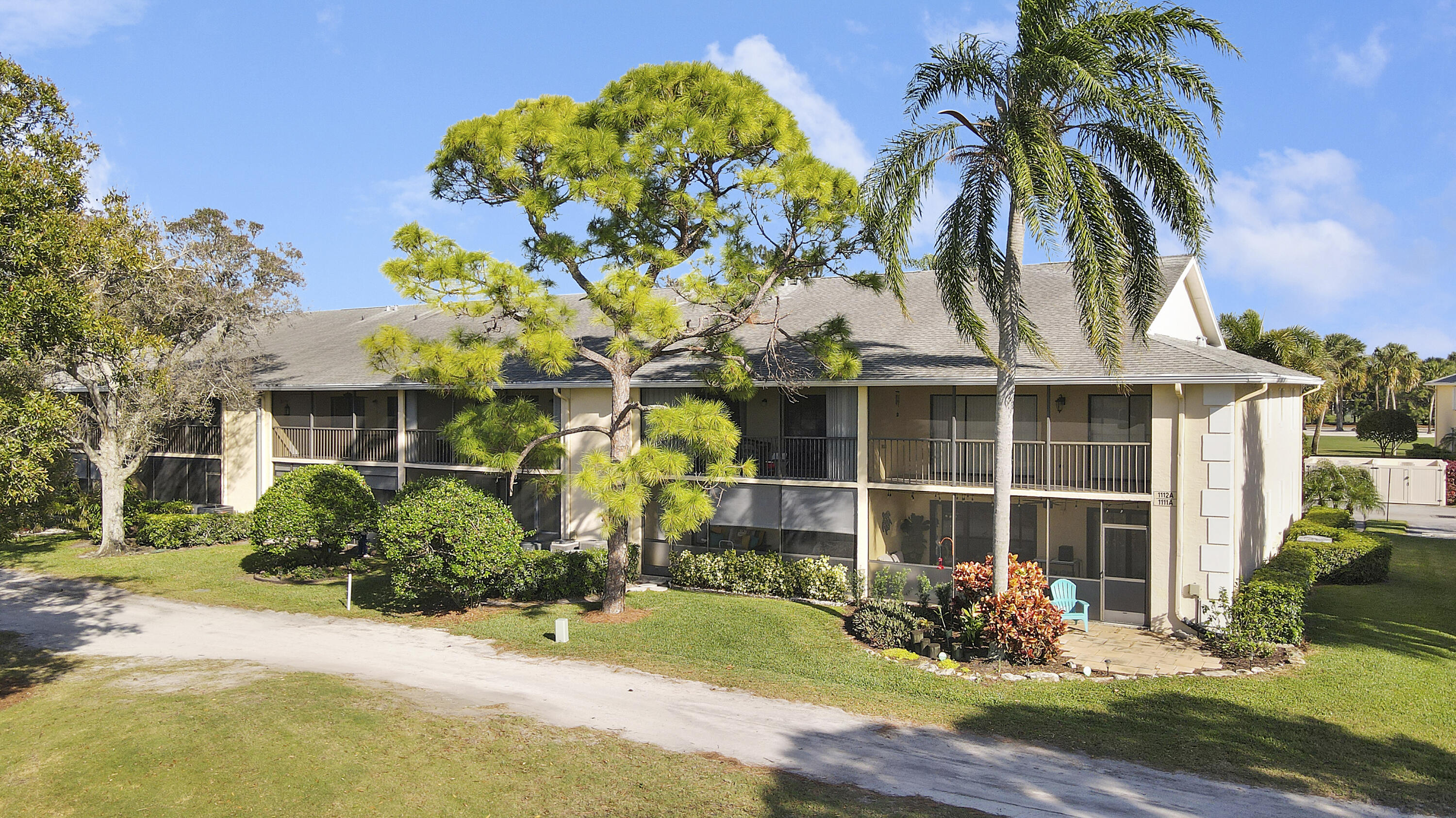 1112 Keystone Drive, Unit A Jupiter, FL 33458 - Photo 34 of 41 a front view of a house having yard