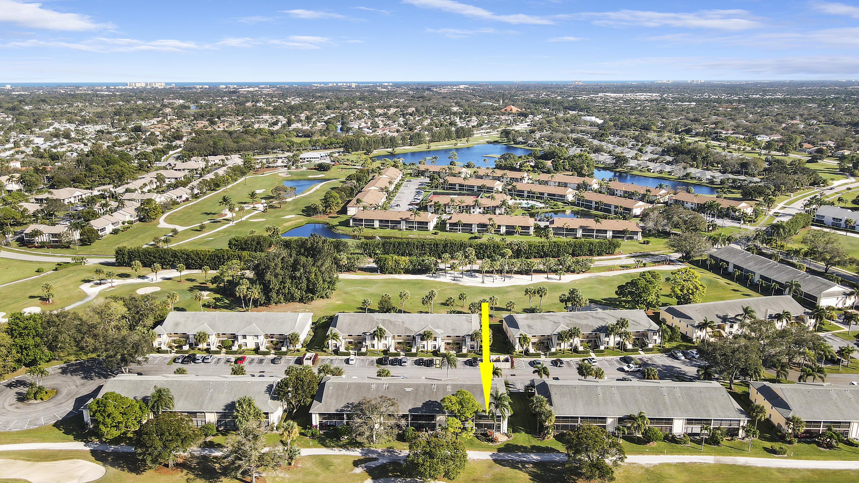 1112 Keystone Drive, Unit A Jupiter, FL 33458 - Photo 35 of 41 an aerial view of a city with lots of residential buildings ocean and mountain view in back