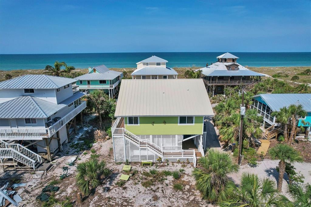 9350 Little Gasparilla Boca Grande, FL 33921 - Photo 1 of 46 an aerial view of a house with a yard