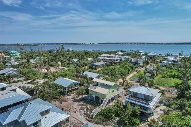 an aerial view of a house with a garden