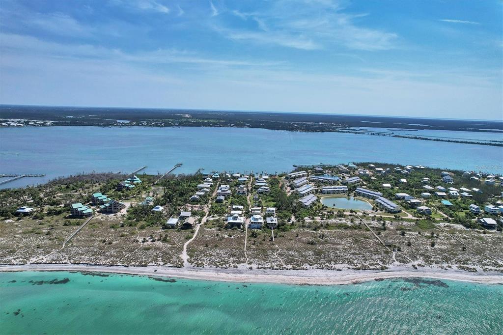9350 Little Gasparilla Boca Grande, FL 33921 - Photo 13 of 46 a view of a lake with a yard