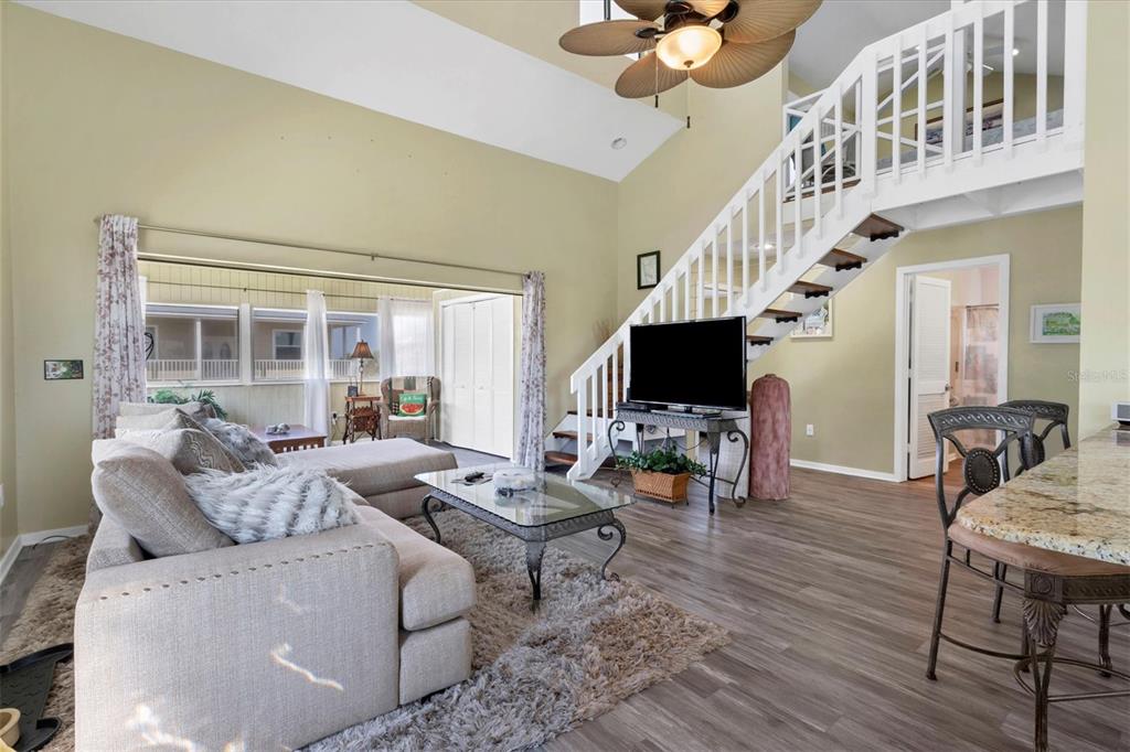 9350 Little Gasparilla Boca Grande, FL 33921 - Photo 22 of 46 a living room with furniture a flat screen tv and a fireplace