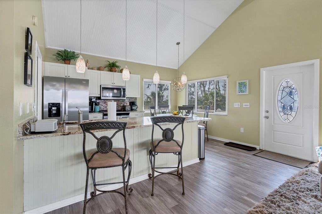 9350 Little Gasparilla Boca Grande, FL 33921 - Photo 23 of 46 a view of a dining room with furniture and wooden floor