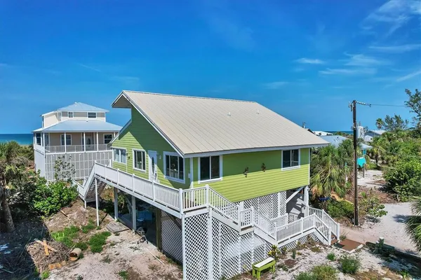 a aerial view of a house with a big yard