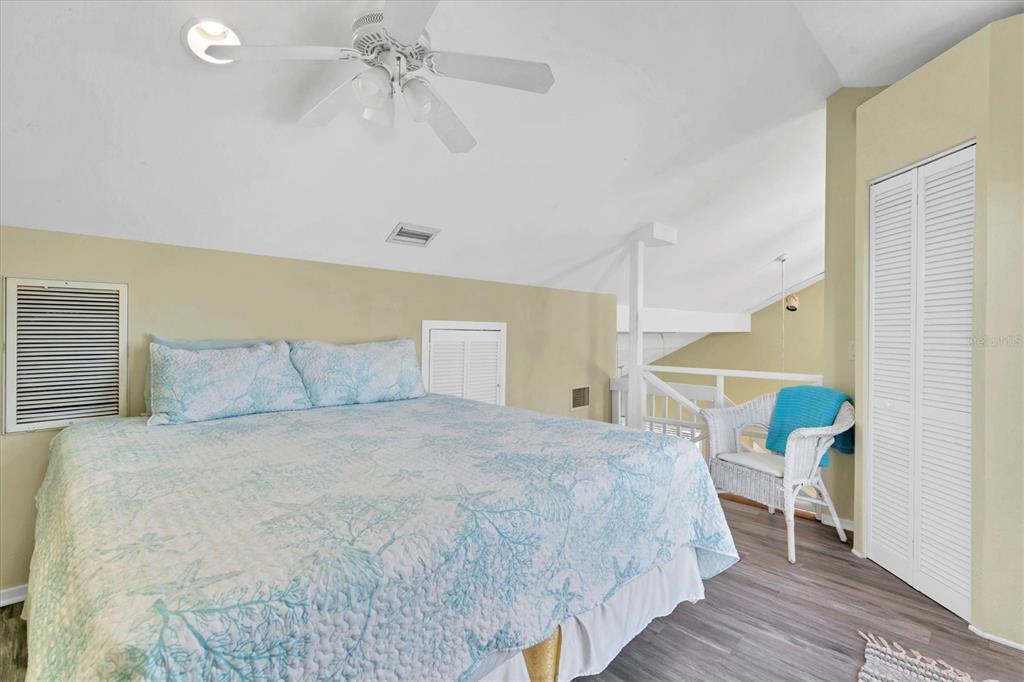 9350 Little Gasparilla Boca Grande, FL 33921 - Photo 37 of 46 a bedroom with a bed and a ceiling fan