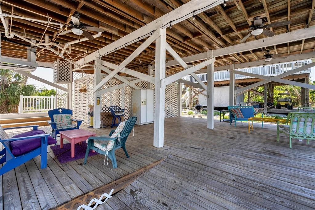 9350 Little Gasparilla Boca Grande, FL 33921 - Photo 39 of 46 a view of a chairs in wooden deck