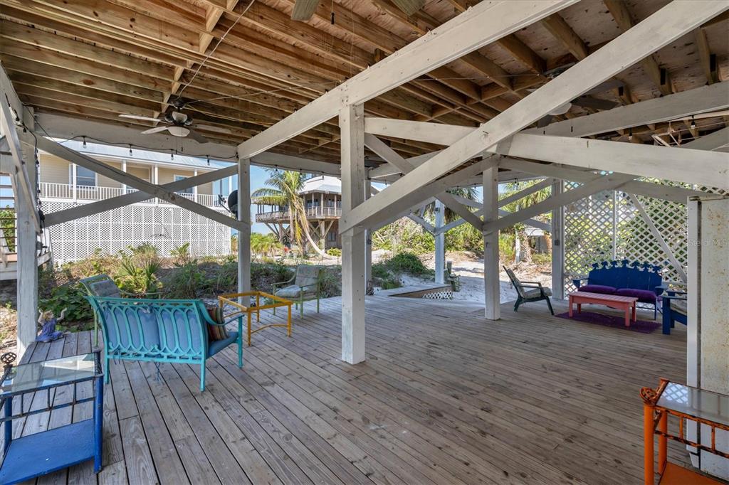 9350 Little Gasparilla Boca Grande, FL 33921 - Photo 40 of 46 a view of a porch with furniture and wooden floor