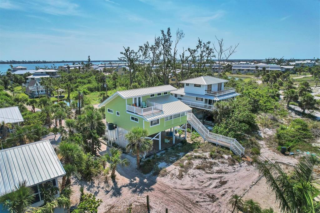 9350 Little Gasparilla Boca Grande, FL 33921 - Photo 5 of 46 a view of a balcony with chairs
