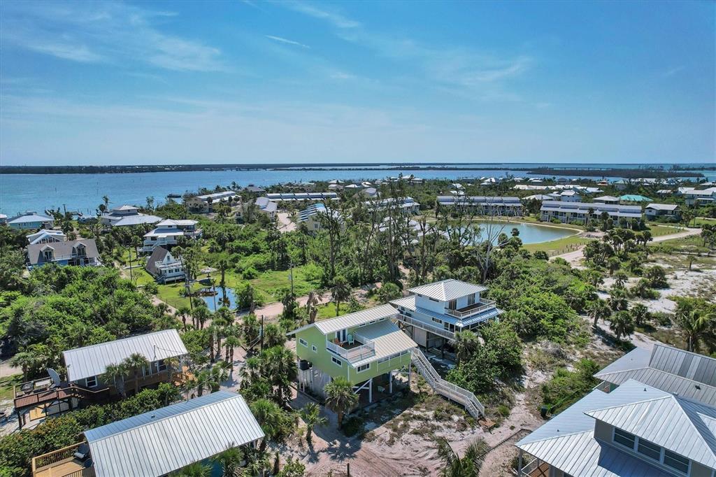 9350 Little Gasparilla Boca Grande, FL 33921 - Photo 10 of 46 an aerial view of a house with a yard