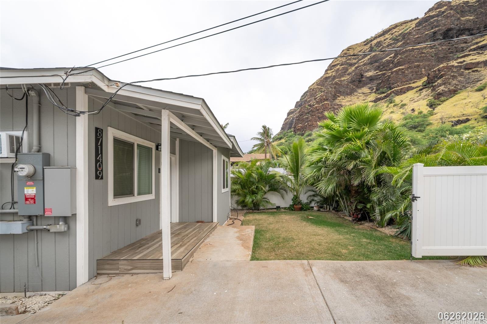 87-1409 Akowai Road Waianae, HI 96792 - Photo 3 of 25 a view of a house with a yard