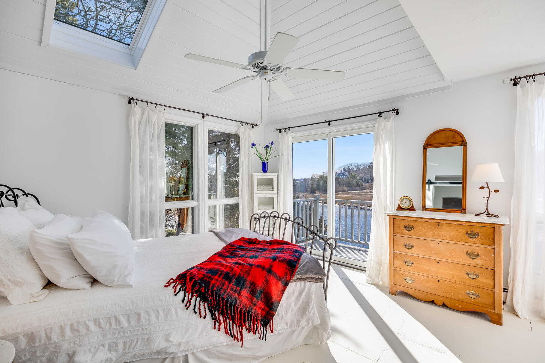 818 South Main Street Centerville, MA 02632 - Photo 28 of 50 a bedroom with a large bed and a dresser