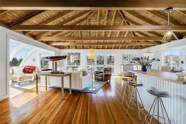 a kitchen with stainless steel appliances granite countertop a sink cabinets and a refrigerator