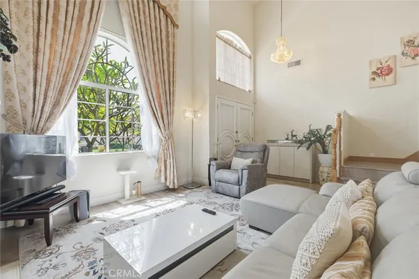 a living room with furniture and a large window