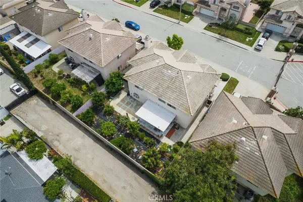 an aerial view of residential house with outdoor space and swimming pool