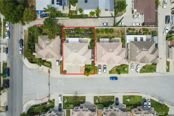 an aerial view of a house with a swimming pool