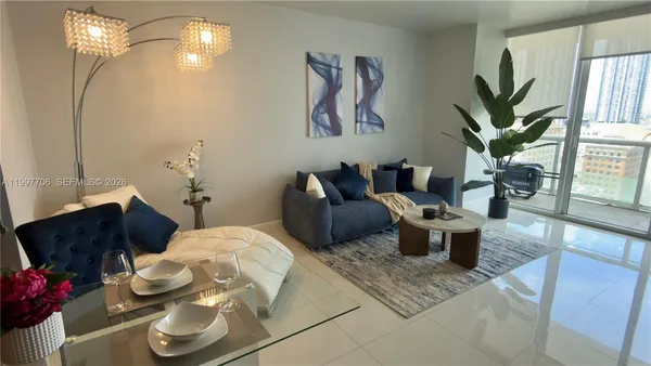 a bedroom with furniture and a potted plant