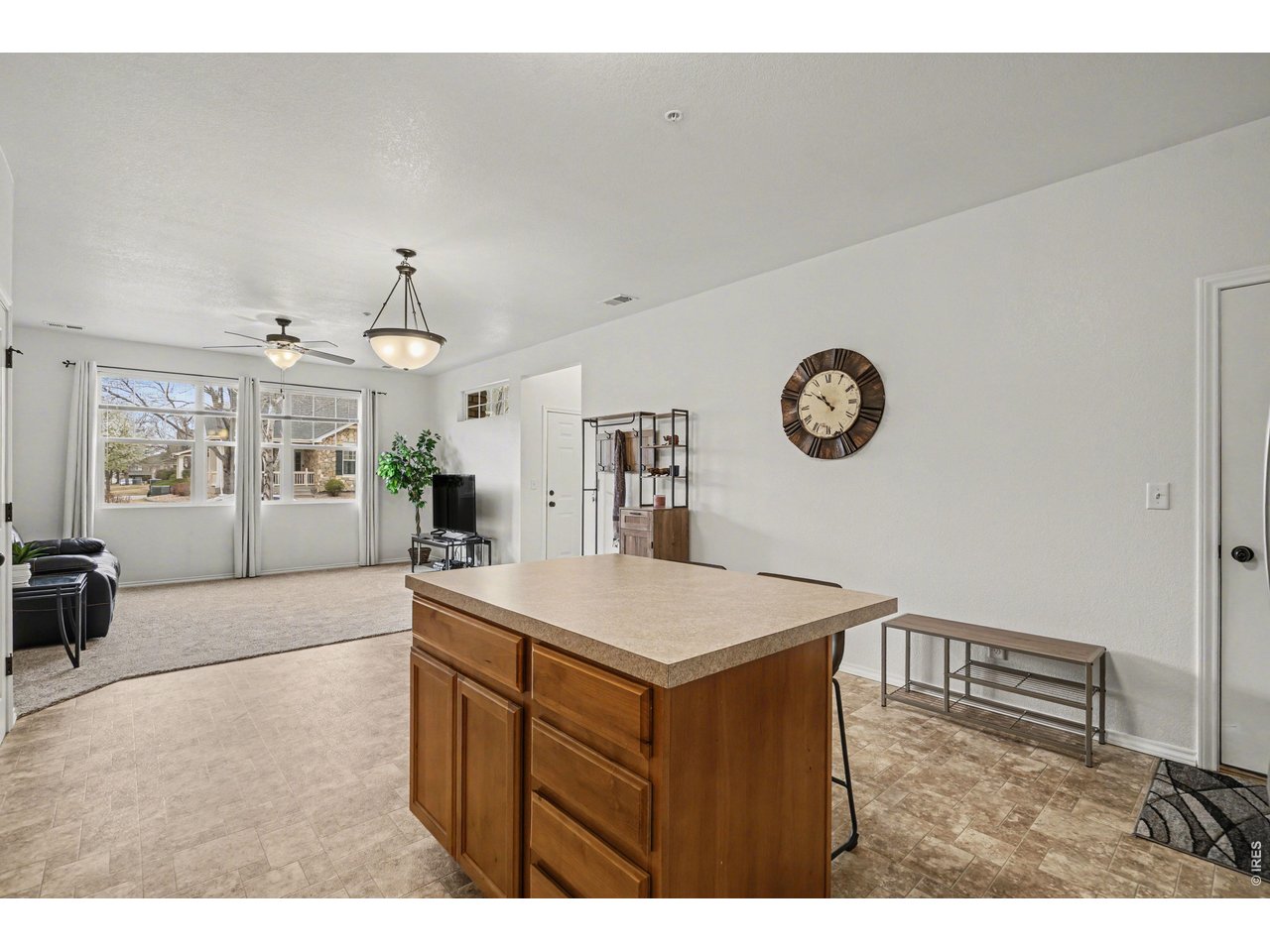 6603 West 3rd Street, Unit 1724 Greeley, CO 80634 - Photo 6 of 23 a kitchen with a sink and a refrigerator