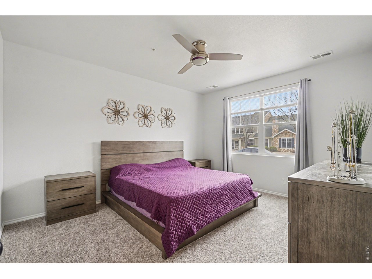6603 West 3rd Street, Unit 1724 Greeley, CO 80634 - Photo 8 of 23 a bedroom with a bed and a dresser