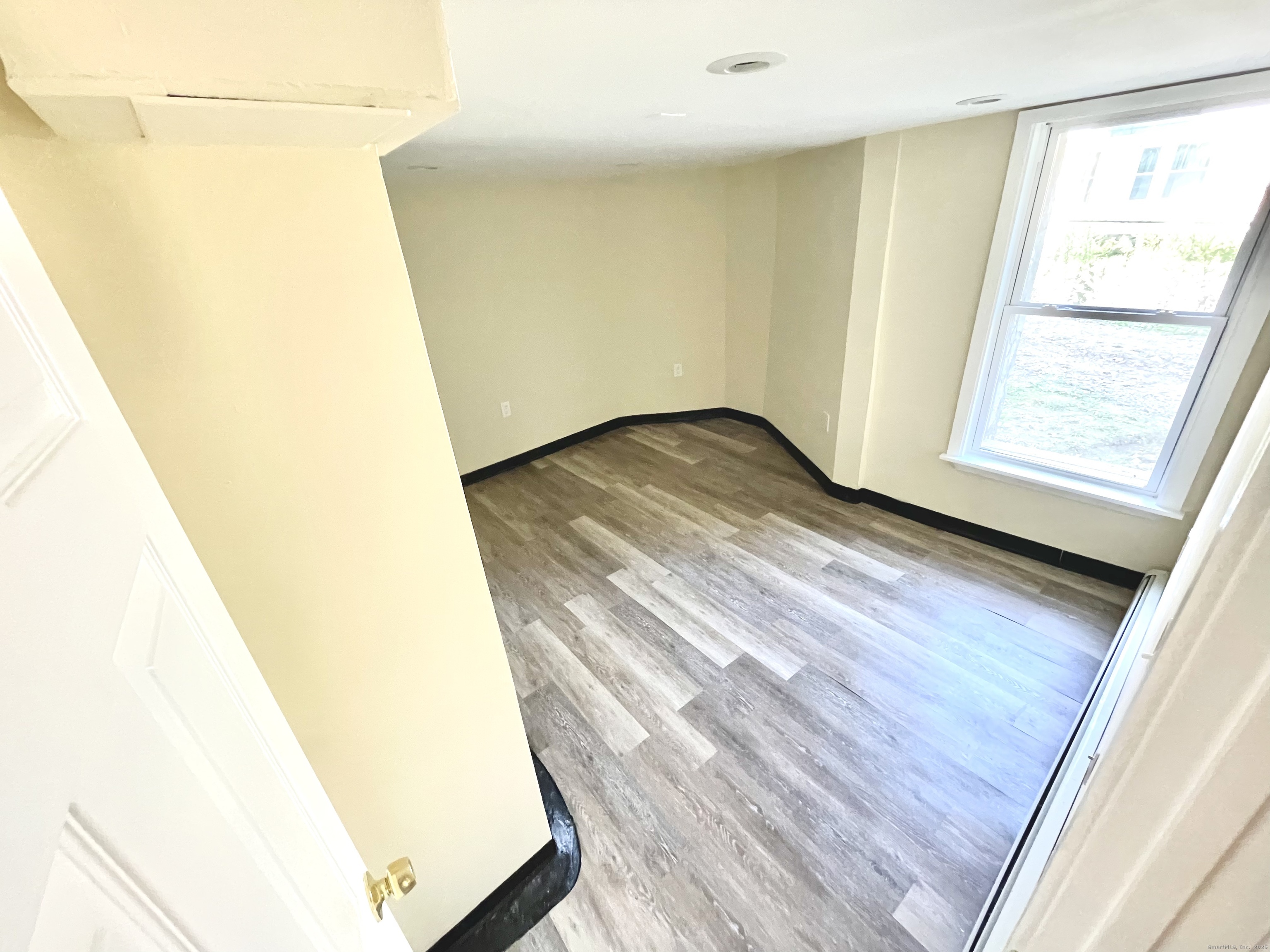 129 Highland Avenue, Unit B Waterbury, CT 06708 - Photo 13 of 17 a view of a wooden floor