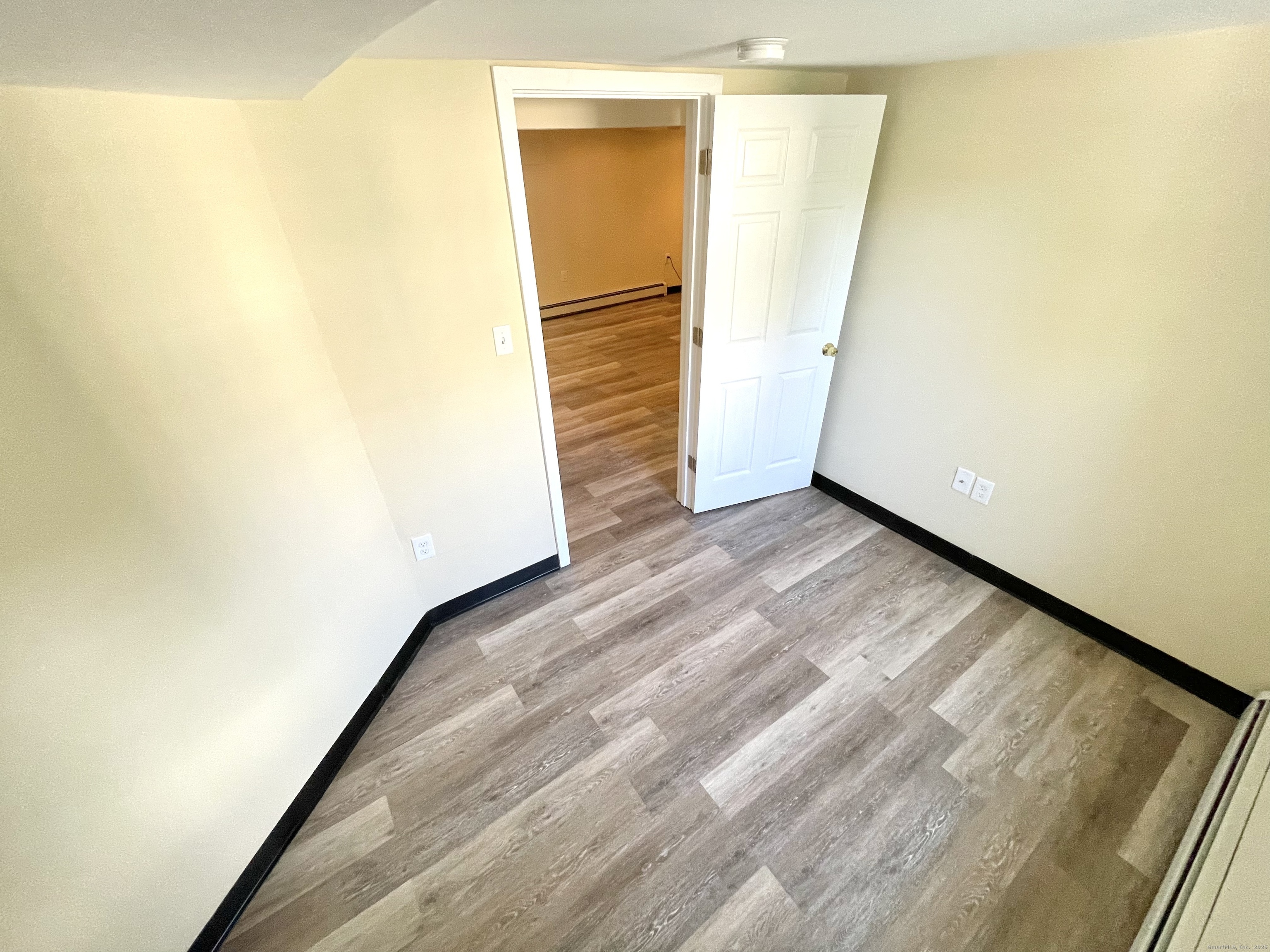 129 Highland Avenue, Unit B Waterbury, CT 06708 - Photo 14 of 17 a view of a room with wooden floor