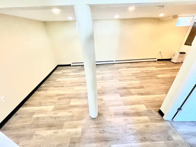 a view of a big room with wooden floor