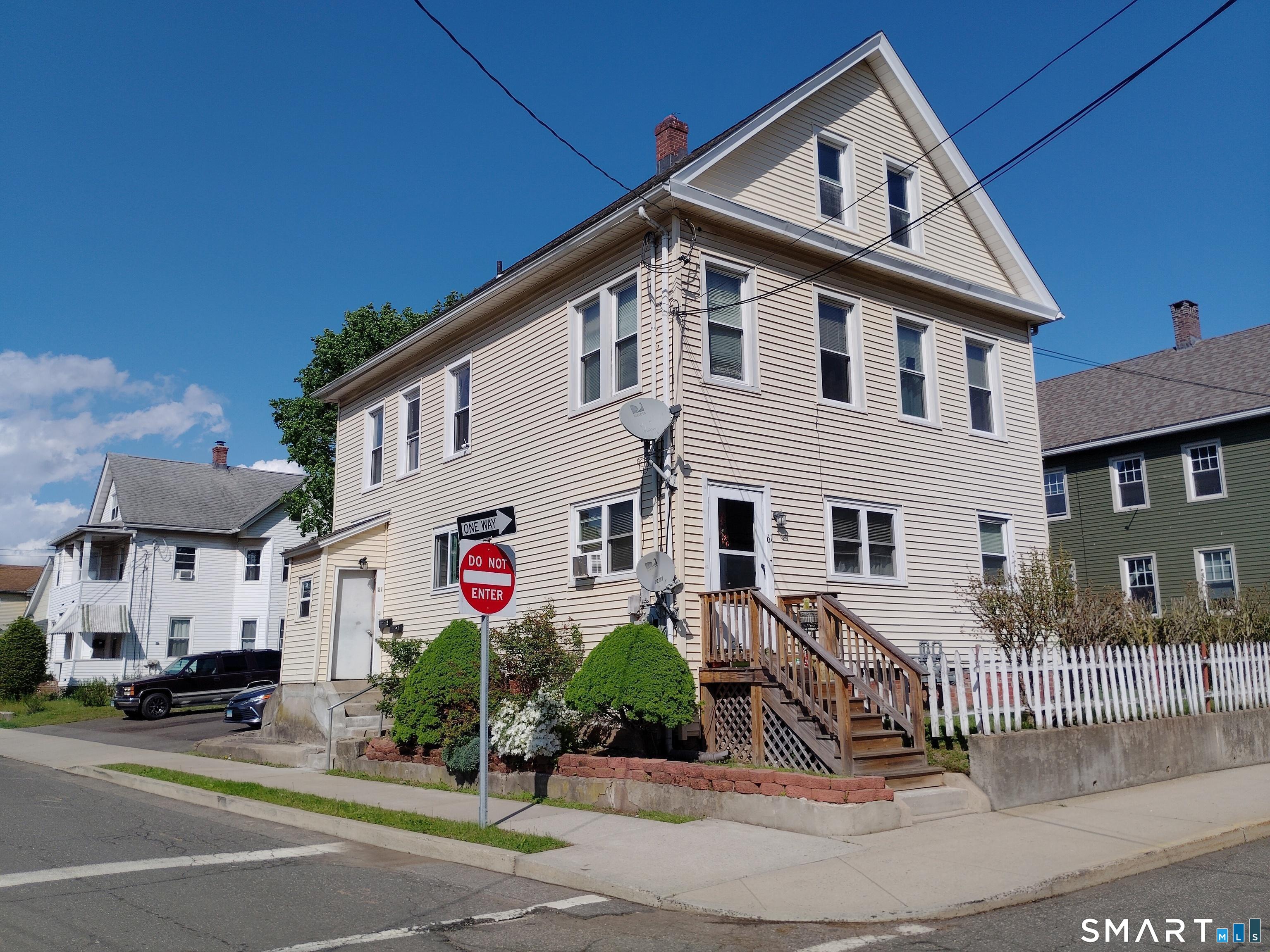 61 Bartlett Street Meriden, CT 06451 - Photo 1 of 30 a front view of a house with a yard