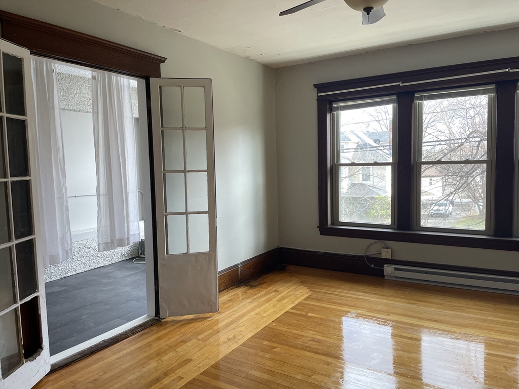 a view of an empty room with a window