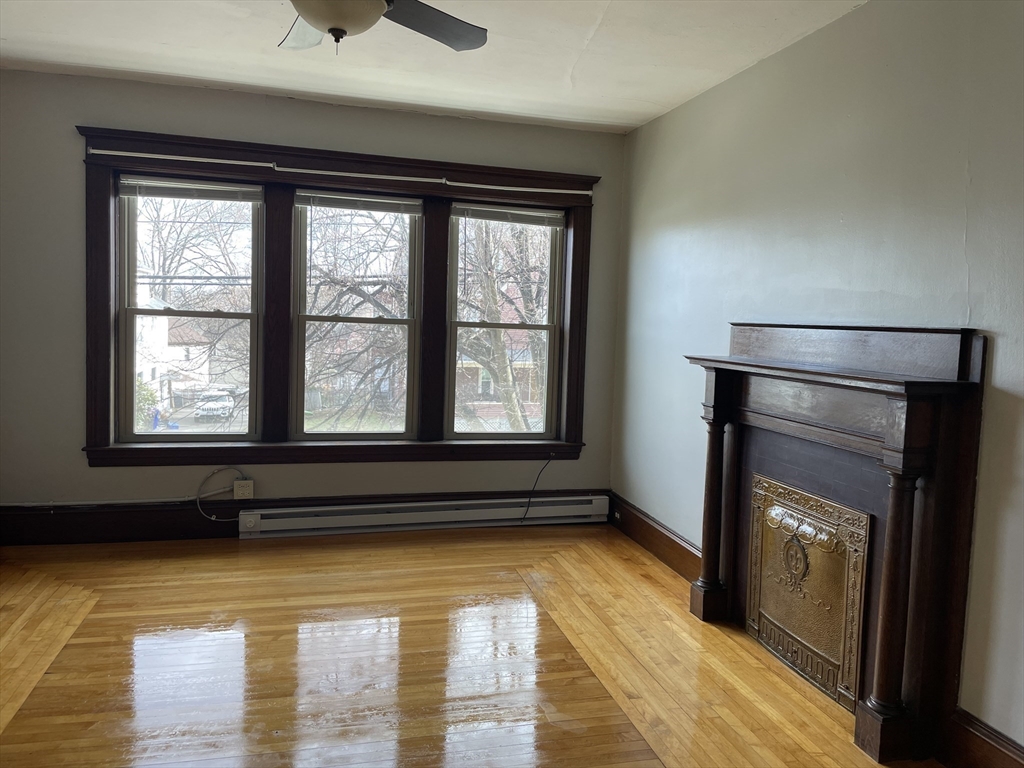 0 Sargeant Street, Unit 3 Holyoke, MA 01040 - Photo 2 of 5 a living room with a large window