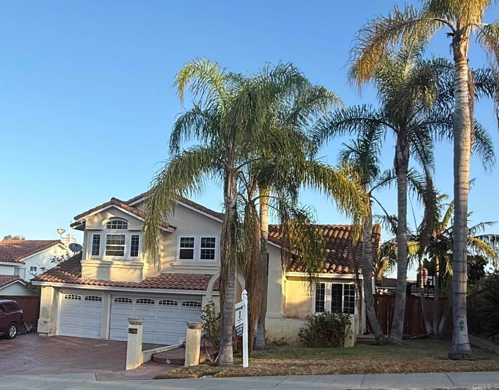 467 Cherry Hills Lane Bonita, CA 91902 - Photo 1 of 42 a front view of a house with a yard