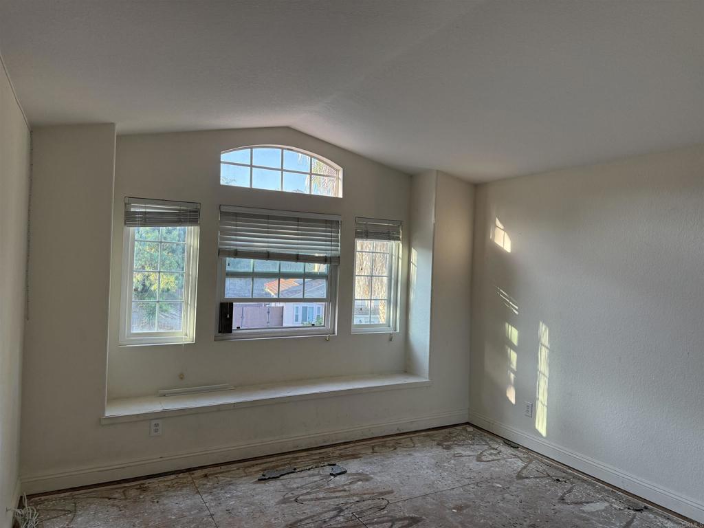 467 Cherry Hills Lane Bonita, CA 91902 - Photo 13 of 42 a view of an empty room with wooden floor and a window