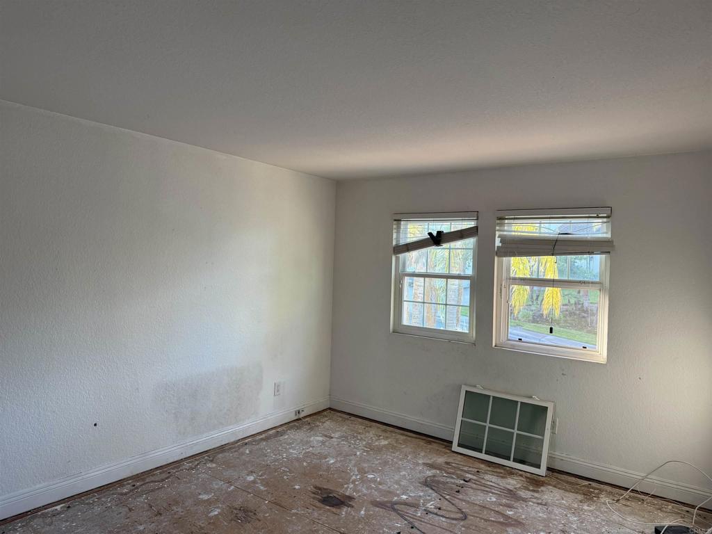 467 Cherry Hills Lane Bonita, CA 91902 - Photo 14 of 42 an empty room with windows
