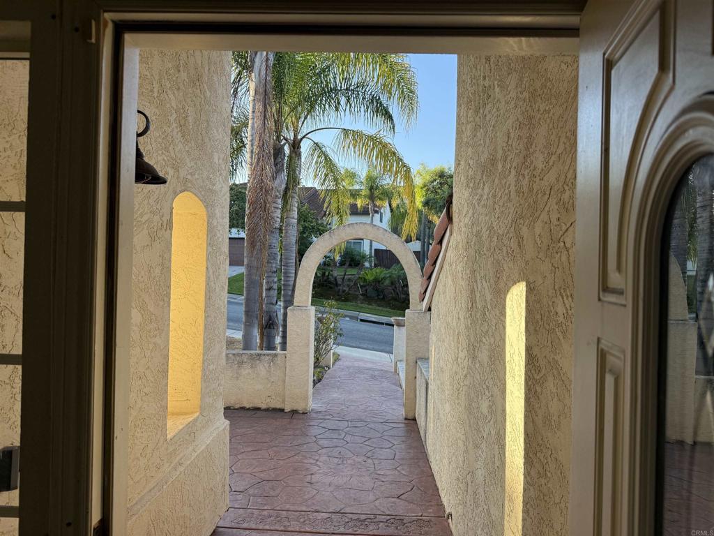 467 Cherry Hills Lane Bonita, CA 91902 - Photo 2 of 42 a view of a hallway with wooden floor and a dining room