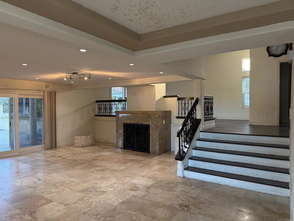 467 Cherry Hills Lane Bonita, CA 91902 - Photo 5 of 42 a view of a hallway with a cabinet and a flat screen tv