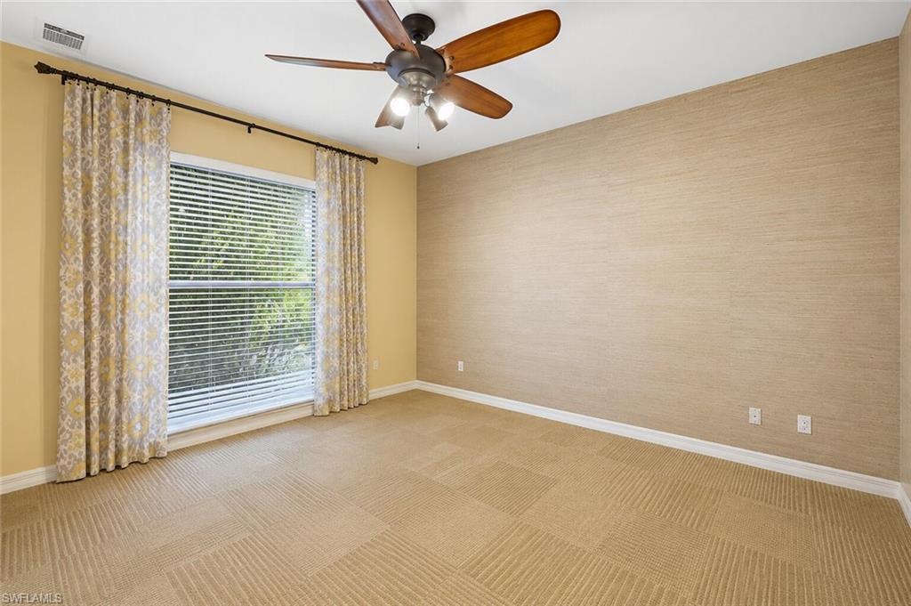 2274 Queens Way Naples, FL 34112 - Photo 17 of 28 a view of an empty room with a window