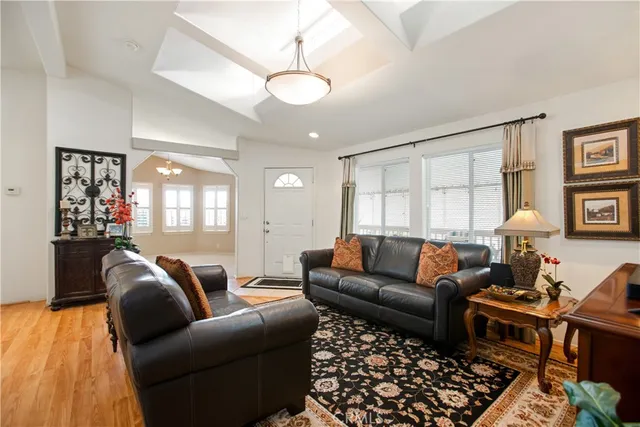 a living room with furniture ceiling fan and a rug