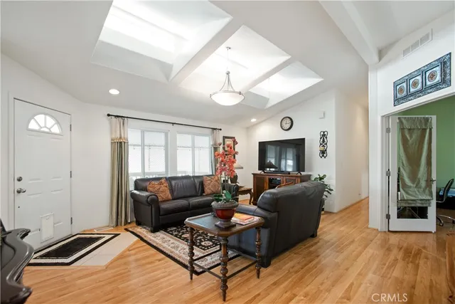 a living room with furniture flat screen tv and a fireplace