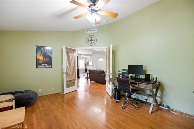 a bedroom with a workspace