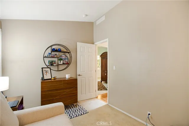 a bedroom with a bed and a closet