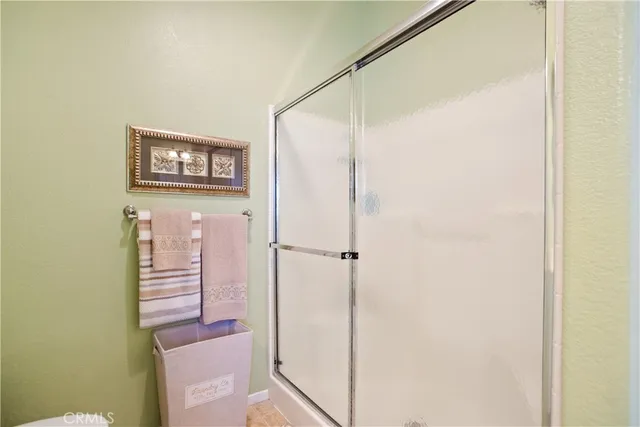 a bathroom with a shower and a sink